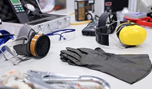 A workbench with a variety of safety equipment