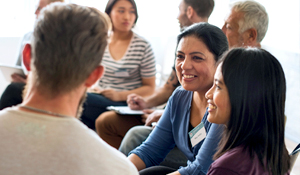group of men and women having a conversation