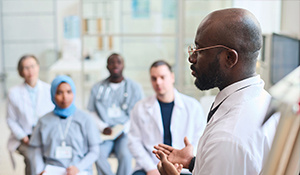 Doctor addressing other healthcare professionals