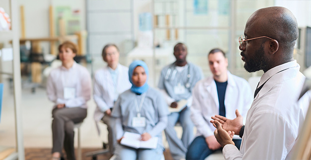 Doctor addressing other healthcare professionals